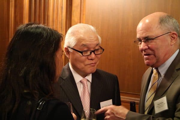 Hon. Keizo Takemi, Member, House of Councillors (center) speaking with Mr. Peter Kelley, President, National Association of Japan America Societies (right) and another guest. 
