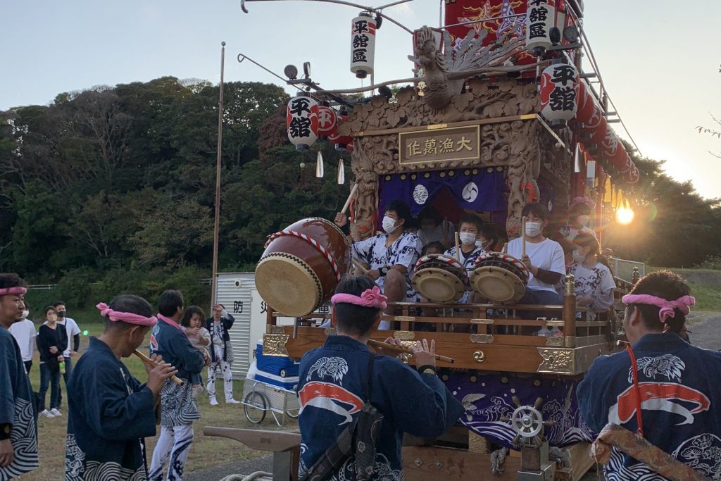 The children of the town play taiko drums on the portable shrine, making it feel like a festival