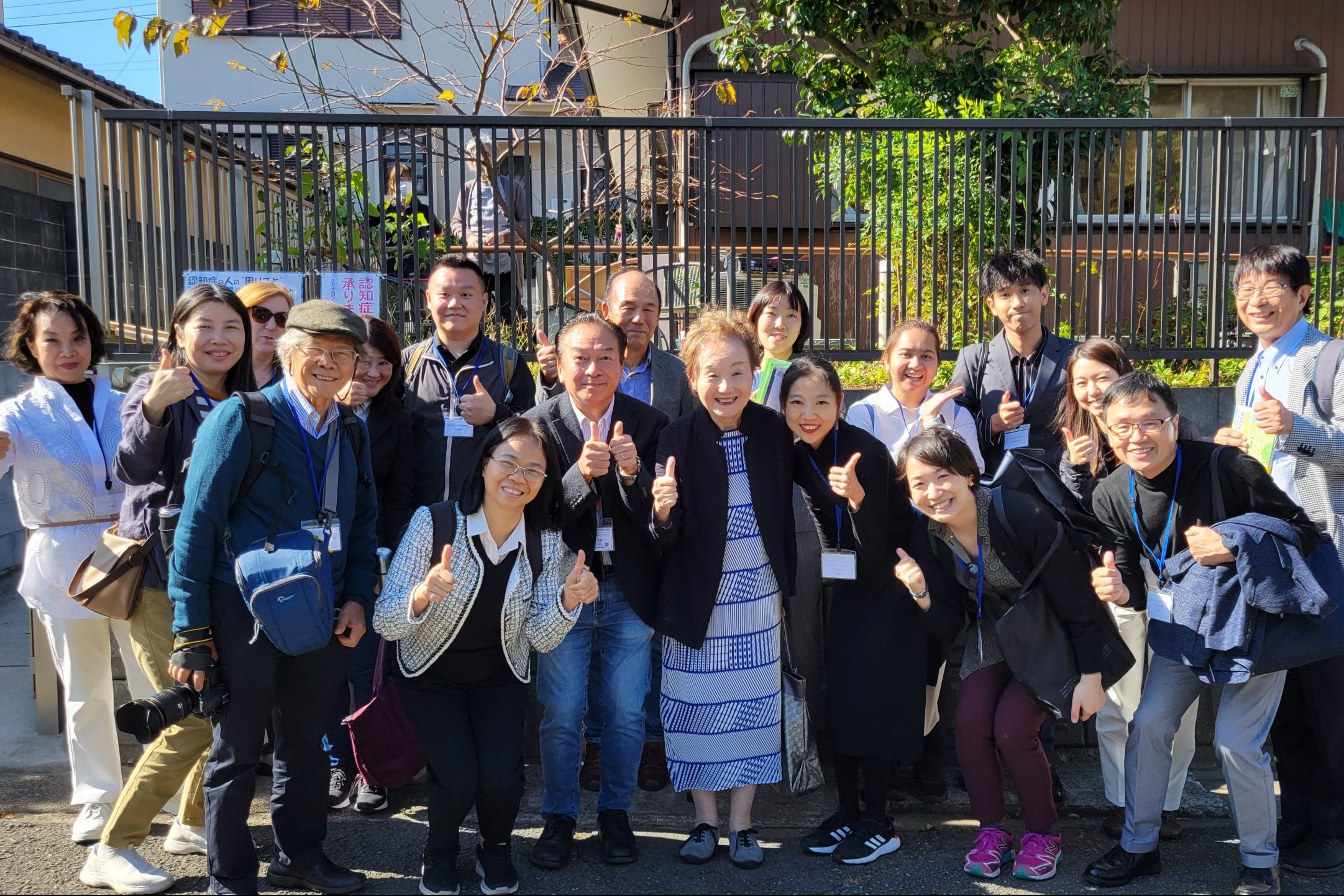 Participants pose with Dr. Akiyama outside Imaizumi care center